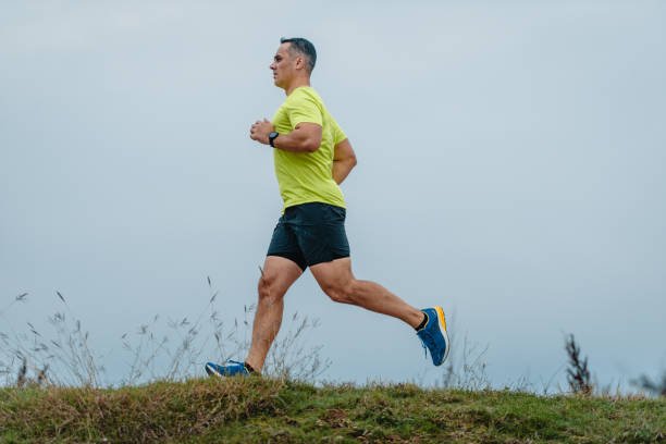 Adult runner training outdoors in South East London for a guide to running after 35