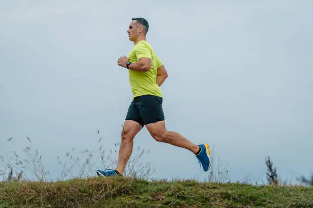 Adult runner training outdoors in South East London for a guide to running after 35